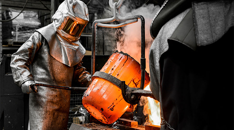 Man in protective suit recycling material